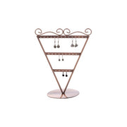 Ørestikkedisplay V-formet. Kobber. H23 cm. 13 par øreringer