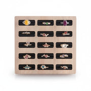 SuperSellerS square bamboo ring display tray with 15 slots and black velvet inserts holding various gemstone rings