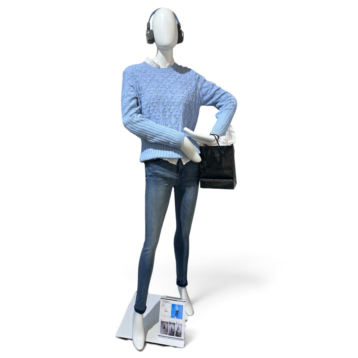SuperSellerS matte white faceless female mannequin with bent arms and mitten hands wearing blue sweater and jeans
