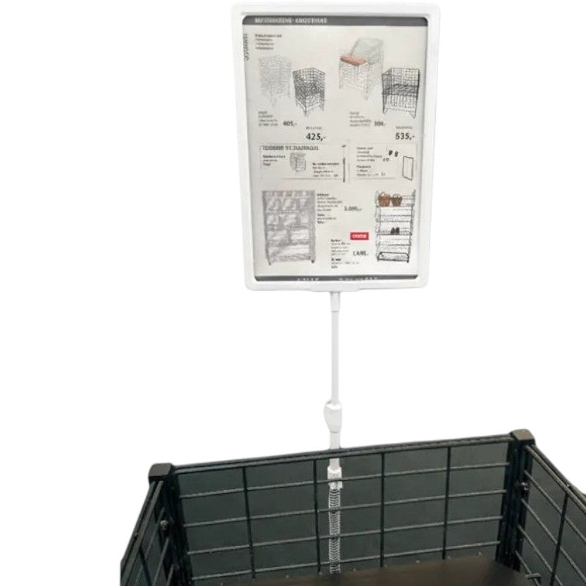 SuperSellerS white A4 sign holder with spring clip mounted on a black wire basket for retail product display.