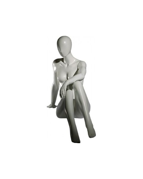 Faceless damemannekeng. Hvit, mat med faceless hoved. Siddende