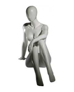 Faceless damemannekeng. Hvit, mat med faceless hoved. Siddende
